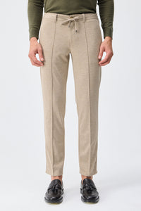 Beige mjuk jerseykostym med kavaj och byxor för män, elegant och casual