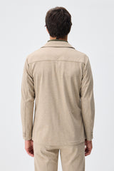 Beige mjuk jerseykostym med kavaj och byxor för män, elegant och casual