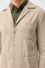 Beige mjuk jerseykostym med kavaj och byxor för män, elegant och casual