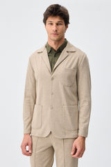 Beige mjuk jerseykostym med kavaj och byxor för män, elegant och casual